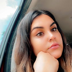 A Woman with Long Hair Looking Out of a Car Window