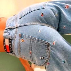 Laura Carvajal in Denim Jeans with Patchwork Design and Branded Belt