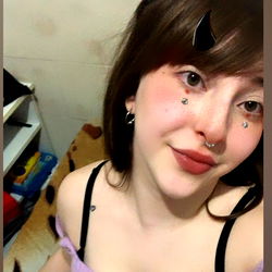 Cami from OnlyFans, Smiling Selfie with Purple Shirt