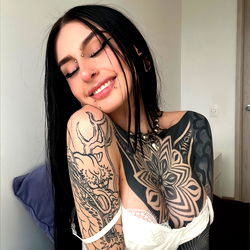 Stylish Tattoo Model Posing for Photo