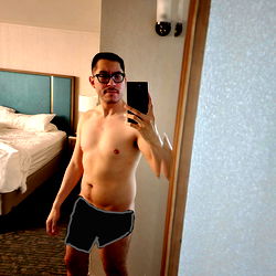 Fitness Model Showcasing Shirtless Abs