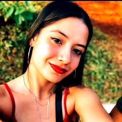 Smiling Woman in Red and Black Dress