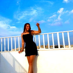 Abaigeal, a Model Striking a Pose on the Balcony