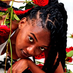 Onlyfans Model with Braided Hair, Surrounded by Roses