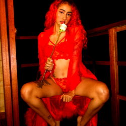 April Valbuena in a red lingerie pose