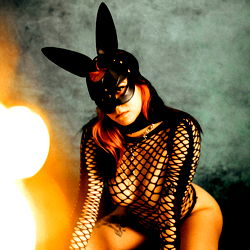 Alice, a Model in Bunny Costume Sitting on Floor