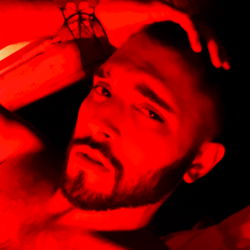 Onlyfans Model Photo: Red and Black Hues, Strong Facial Features