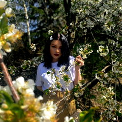 Elaine, an OnlyFans Model, Poses for the Camera amidst a Blossom of Flowers