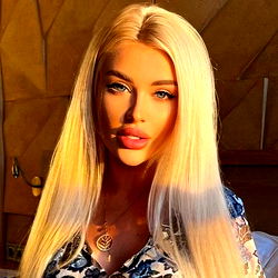 Model Posing with Blonde Hair and Highlighted Makeup