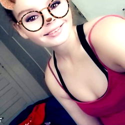 Babycakes, a St. Louis-based OnlyFans model named 'Babycakes', shares a photo on Instagram with a teddy bear headband and glasses as an accessory, set against a pink wall backdrop.