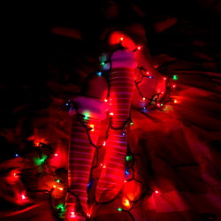A Festive Scene: Holiday Lights and Decorations in a Bedroom