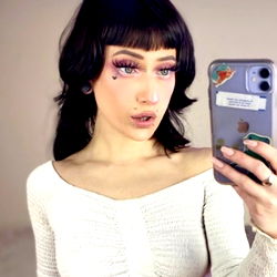 Alexa, a Washington-based model, showcasing her vibrant makeup and expressive eyes. A captivating selfie captures the essence of her unique style.