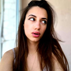 Jasmin Hotlady, a beautiful young woman with striking makeup and piercing eyes