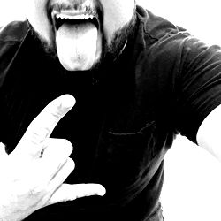 Daniel, a Fitness Enthusiast Showcasing His Muscles and Tattoos