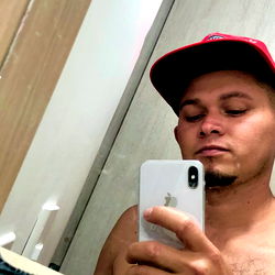 A candid moment of a bathroom mirror selfie by Onlyfans model Pequeño angelito