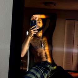 Xander in a contemplative pose in his room