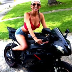 Beretta, Onlyfans Model, Kneeling on a Sleek Black Motorcycle