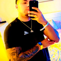 Amaury Posing for Camera in Black Tank Top