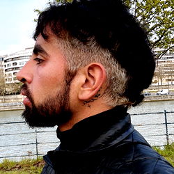 Mexican athlete with shaved head and beard, outdoors