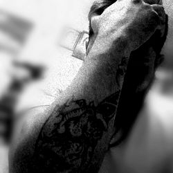 Artistic Black and White Photo of a Man with Tattoos