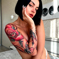 Megan Orlowski Showcasing Tattoo and Style