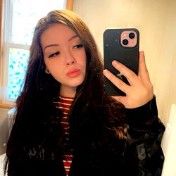 Model Jolene in a West Virginia setting, with a captivating gaze and striking pose