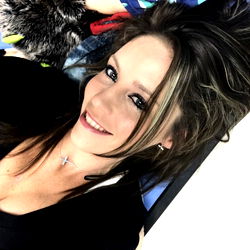 Alannarack's Playful Pose on a Colorful Wall