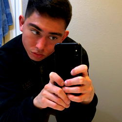Raul from OnlyFans poses in bathroom mirror