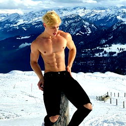 Fitness Model Alam Wernick Poses in a Snowy Landscape