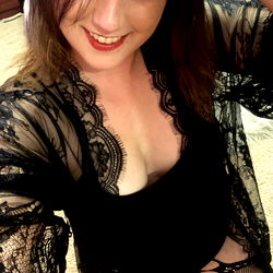 AJ, a lingerie model sharing her allure in an OnlyFans photo