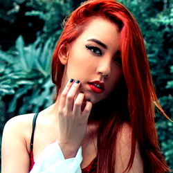Amra, a striking red-haired model