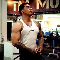 Strong and Lean Bodybuilder Posing in Gym