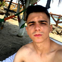 Andres in a beach setting