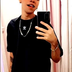 Andrés, a young and stylish man from Colombia, showcases his look with a modern twist. His fashionable attire and unique pose make this image stand out.