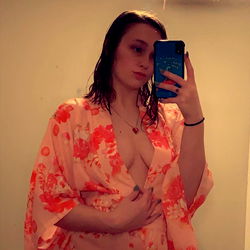 Aubrie, a Texas-based model posing in a floral kimono for her OnlyFans page.