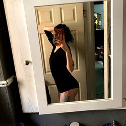 Wonderland's Alice in a Black Body Suit