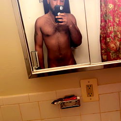 Model Showcasing Physique in Bathroom Mirror