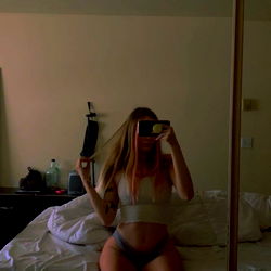 Intimate Moment in a Model's Bedroom