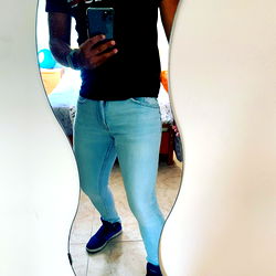 Fashionable Fitness Model in Denim Jeans and Sneakers