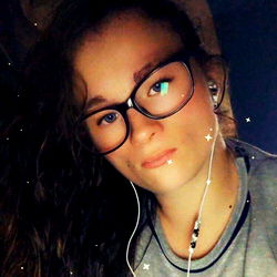 A Young Lady with Glasses and Headphones