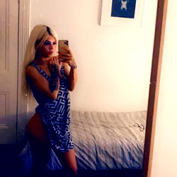 Babby, 30-year-old OnlyFans model taking a selfie in a bedroom