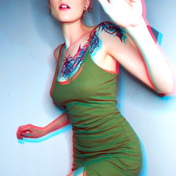 Fashionable OnlyFans Model in Distinctive Tank Top with Tattoo