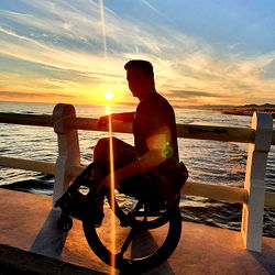 A serene sunset with Armin, the wheelchair-riding enthusiast