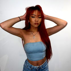 Young Model with Vibrant Red Hair and Green Tank Top