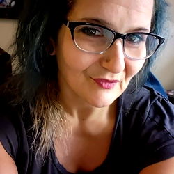 Angel in Chic Glasses with Tattoo