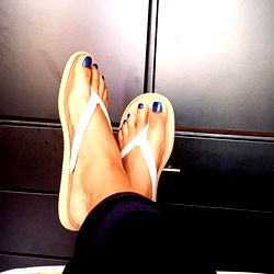 A Model's Feet in a Flip-Flop