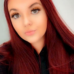 Beautiful red-haired woman posing for OnlyFans