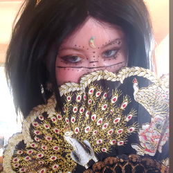 Striking pose with fan