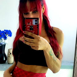 OnlyFans Model Ashleysexyts from Colombia Posing in Bold Red and Black Skirt