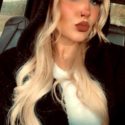 Young Lady with Blonde Hair and Dramatic Makeup, Outdoor Background